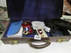 A Mason's case containing gloves, manuals, sash,