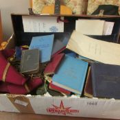 A Masonic case and contents including Aprons and books