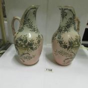 A matching pair of circa 1887 Royal Doulton Lambeth Carrara ware ewer vases,