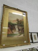 A framed and glazed watercolour of bridge and waterfall by J K Knowles