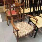 An Edwardian inlaid elbow chair