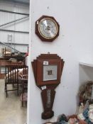 An Art Deco barometer and a modern barometer