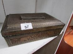 A Huntley and Palmer biscuit tin with some coins