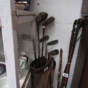 A vintage golf bag and clubs