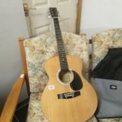 An Elevation accoustic guitar with soft case