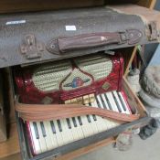 A 'Barcarole' piano accordian in case (distressed)