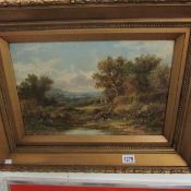 A framed oil on canvas of figures in extensive landscape, signed Frederick Yates 1854 - 1911,