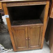 An oak bedside cabinet