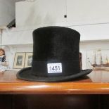 A vintage black silk top hat