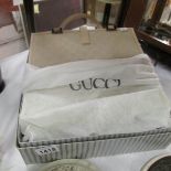 A boxed Gucci hand bag