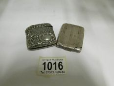 A silver match case and an ornate silver plated vesta