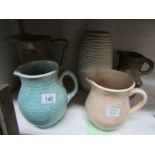 4 jugs and a vase,