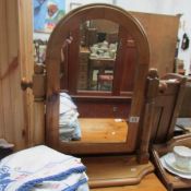 A pine toilet mirror