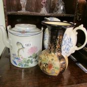 An Oriental pottery teapot, toilet jug and an early Chinese vase,