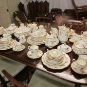 Approximately 80 piece of Royal Albert 'Tenderness' tea and dinnerware including meat platters,