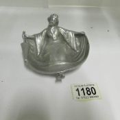 A vintage woman in erotic post in silver coloured metal