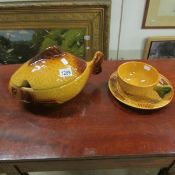 A large lidded fish shaped soup tureen with matching plate and dish (Eastern European)