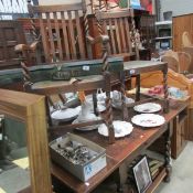 An oak draw leaf table and 5 chairs with barley twist supports