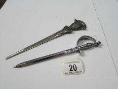 An Art Nouveau letter opener with silver handle and a 'sword' letter opener