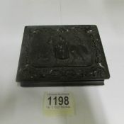 A Daguerreotype case with carved exterior