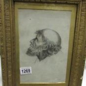 A framed and glazed drawing of a bearded man,