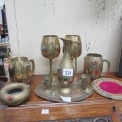 A quantity of stone inset brass ware