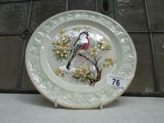 A Royal Worcester plate hand decorated with a Bullfinch