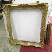 A decorative gilt picture frame, approx.