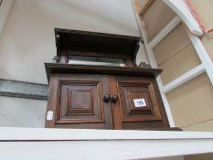 A wall hanging key cabinet