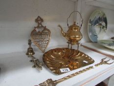 A brass crunb tray, toasting fork, trivet, nut crackers,