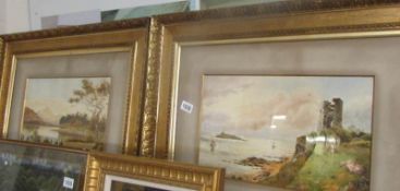 A fine pair of gilt framed watercolours 'Lake & Mountain landscape' and Derelict castle of