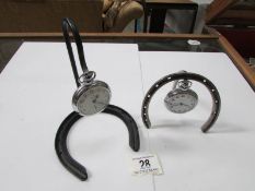 2 Ingersol pocket watches on horse shoe stands
