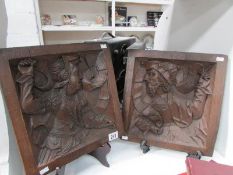 2 medieval style plaques depicting a gentleman and a lady in oak effect resin