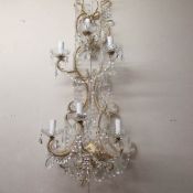 A 6 lamp chandelier style wall light
