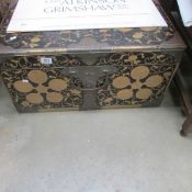 An Oriental chest with brass inlay and brass fittings