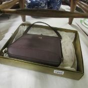 A boxed Dunhill hand bag