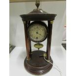 A four pillar clock with enamel dial