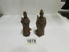 A good pair of old Oriental bronze figures
