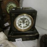 A Victorian marble mantel clock with bell chime and key