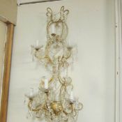 A 6 lamp chandelier style wall light