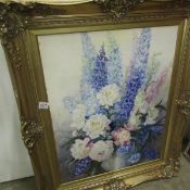 A gilt framed painting on board floral arrangement