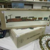 A boxed limited edition tin plate train and a boxed sea plane