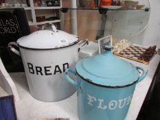 An enamel bread bin and an enamel flour bin