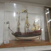 A scratch-built wooden model of HMS Prince 1670 in display case
