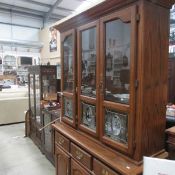 A good quality oak glazed top dresser with engraved glass panels
