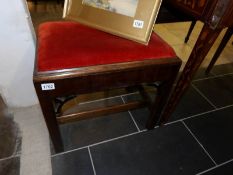 An Edwardian mahogany piano stool