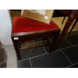 An Edwardian mahogany piano stool