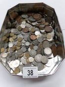 A tin of mixed UK coins