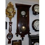 A mahogany wall clock