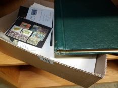 A quantity of loose stamps and an album of Commonwealth stamps